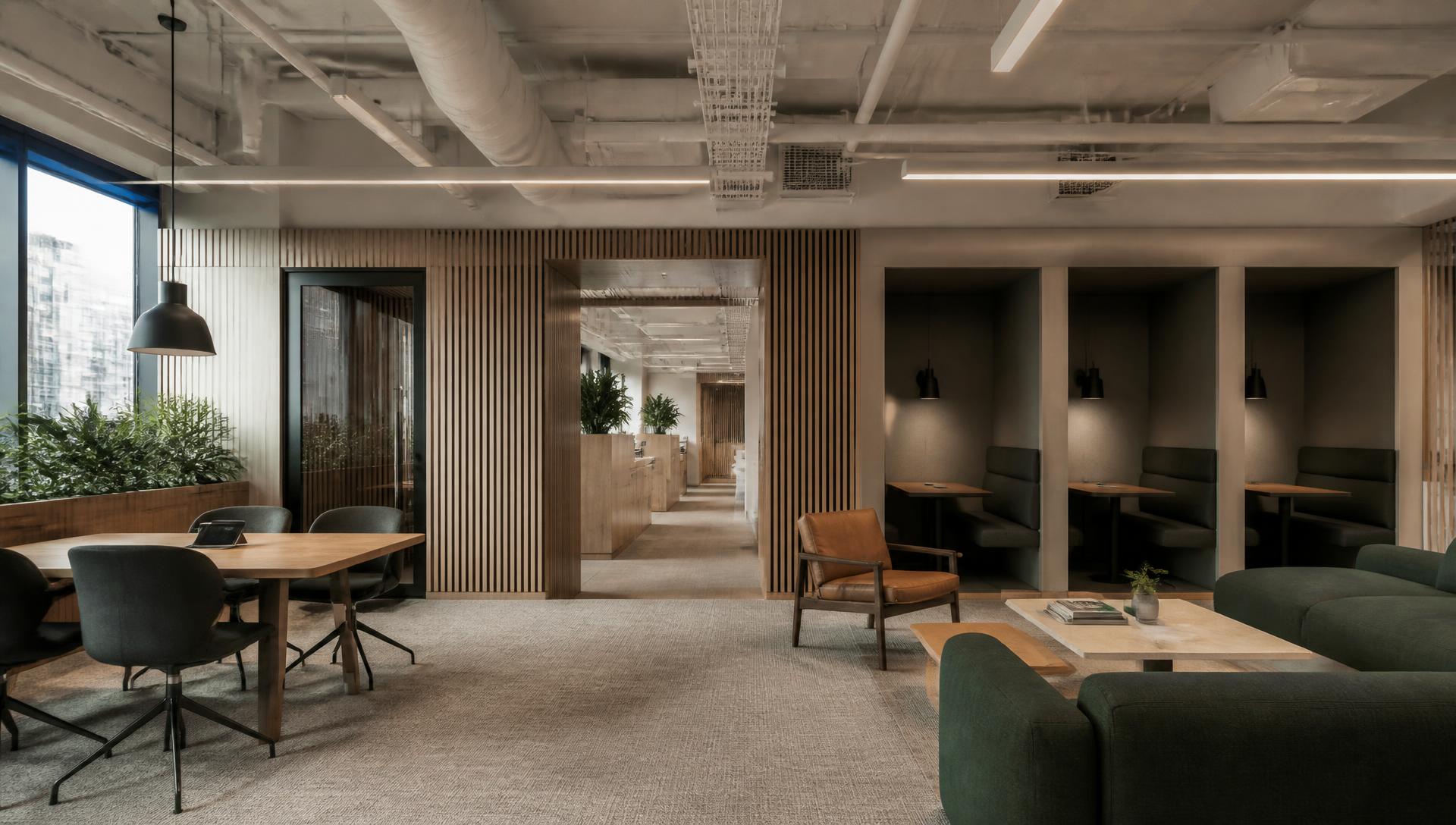 Ufficio rinnovato con aree focus, sedute lounge e pannelli acustici in legno